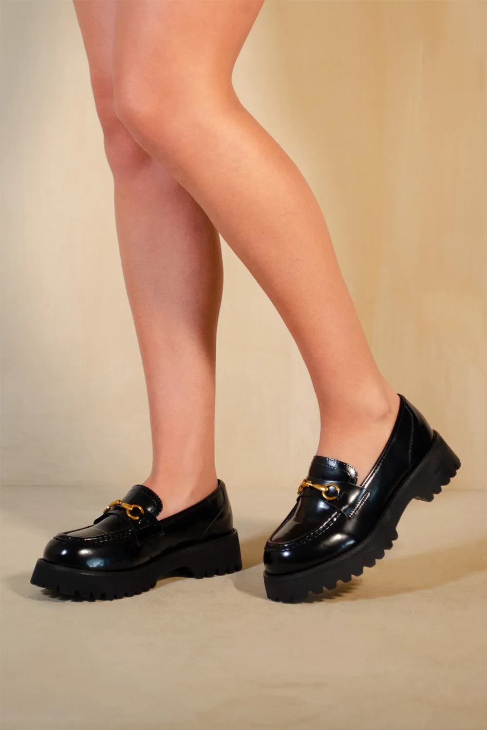 MURIEL CHUNKY SOLE SLIP ON LOAFERS WITH METAL DETAIL IN BLACK HIGH SHINE